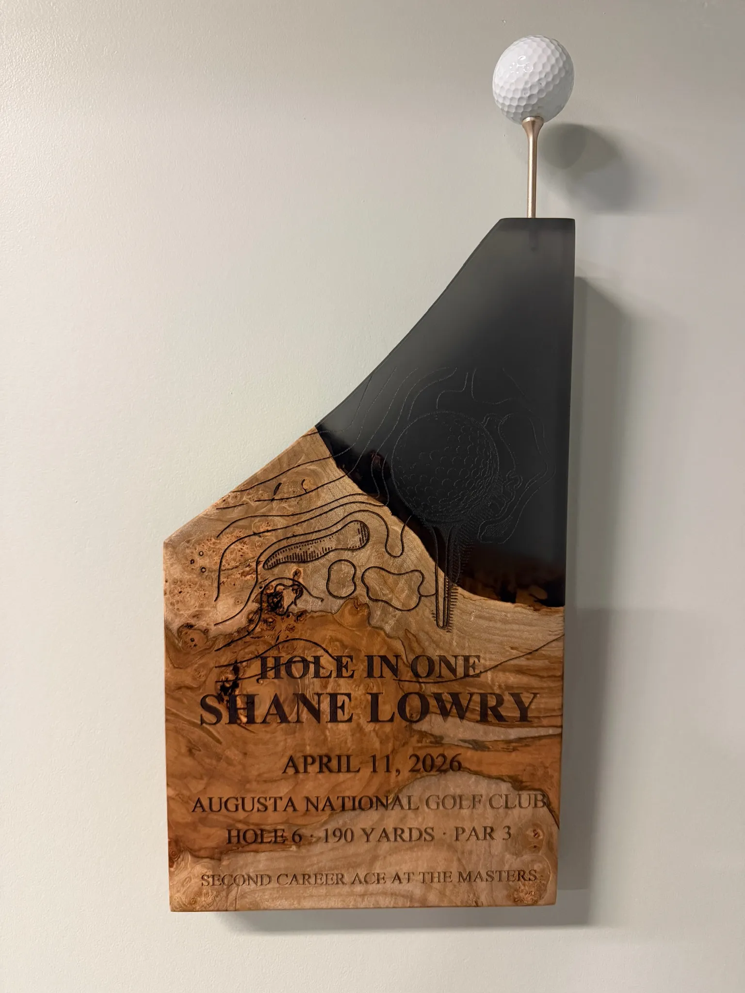 Burl wood and black epoxy resin hole-in-one plaque for Shane Lowry, Augusta National Golf Club, with engraved topographic hole map, golf ball mounted on steel pin.